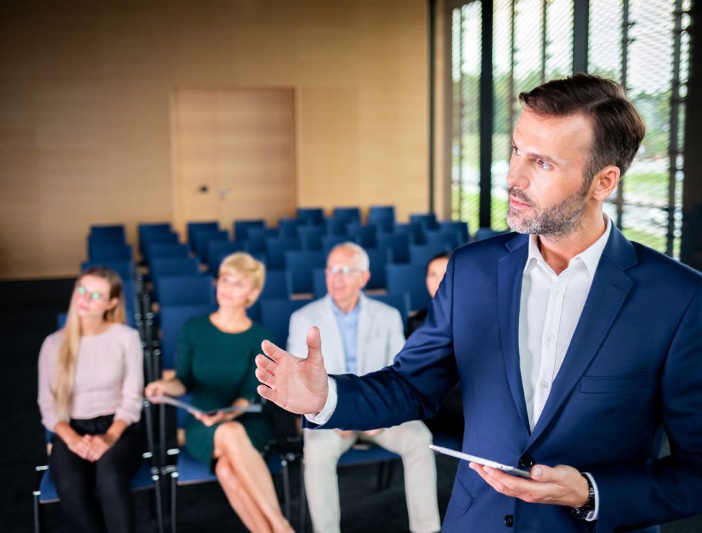 businessman coach in the auditorium 2021 08 29 16 27 06 utc 1